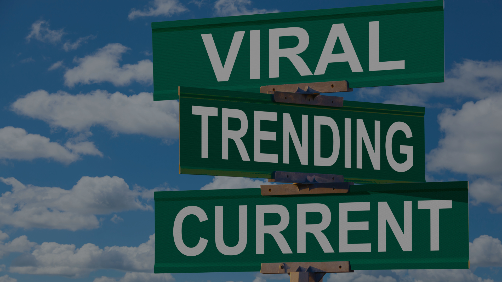 The sky with clouds and traffic sign with three boards that say ‘ Viral, Trending, Current